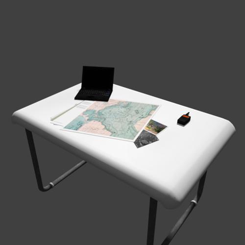 Table with laptop, radio and documents