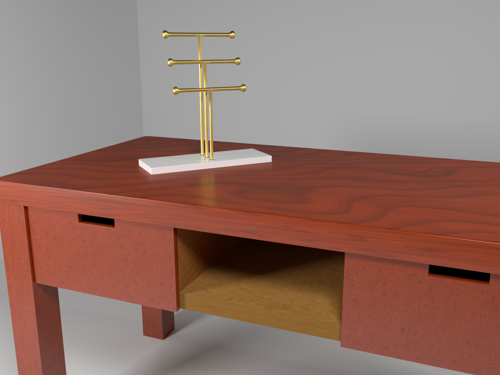 Golden jewelry holder on mahogany desk